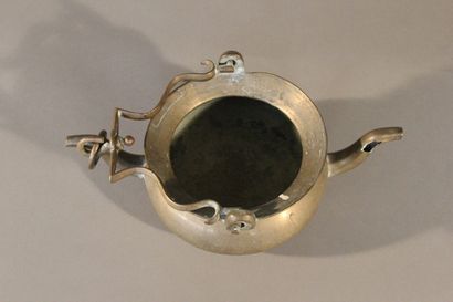 Bronze pitcher with two spouts and a mobile...