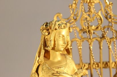 Clock in gilded and chased bronze.

The upper...
