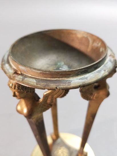 
Pair of gilt bronze cups supported by sphinxes...