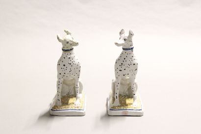 Pair of seated dalmatians in polychrome earthenware.

Rectangular...