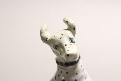 Pair of seated dalmatians in polychrome earthenware.

Rectangular...