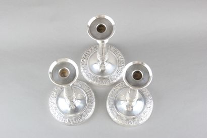 Suite of three candlesticks in silver plated...