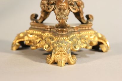Pair of bronze and black marble candlesticks...