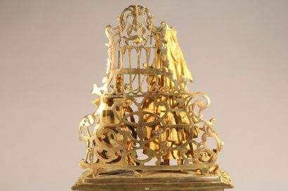 Clock in gilded and chased bronze.

The upper...