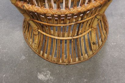 Pair of rattan armchairs.

The openwork back.

Circular...