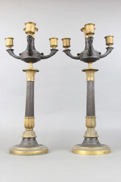 Pair of candelabras with four lights in chased,...