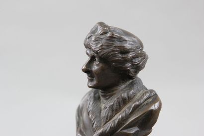 Pair of patinated bronze desk busts representing...