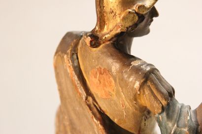 Antique soldier in armor.

Subject in polychromed...