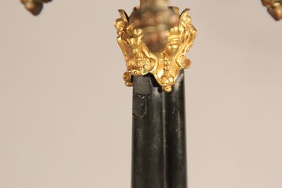 Pair of bronze and black marble candlesticks...