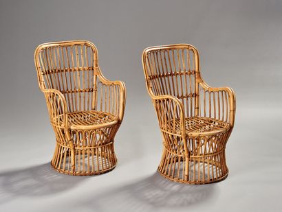 Pair of rattan armchairs.

The openwork back.

Circular...
