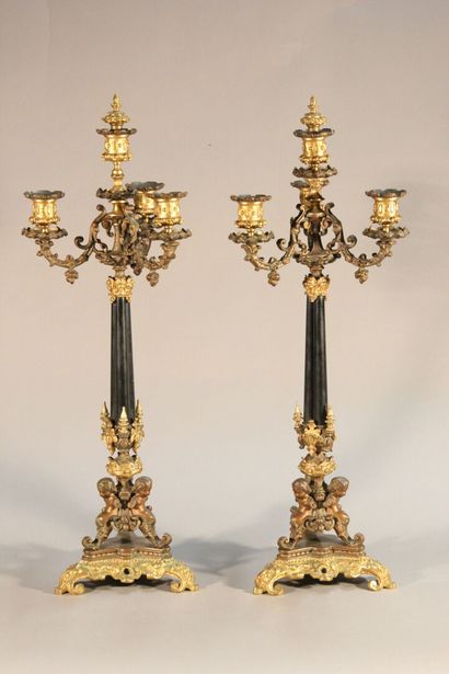 Pair of bronze and black marble candlesticks...