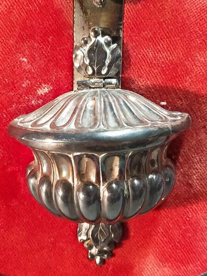Christ on the cross in silver.

On a red...