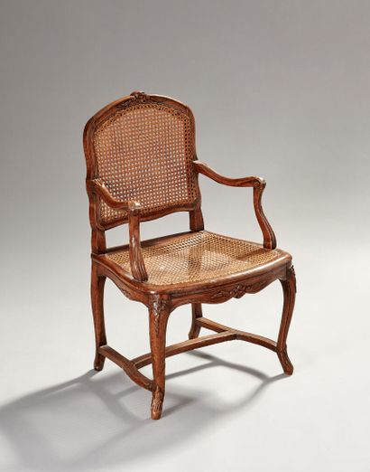 Armchair in natural wood molded and carved...