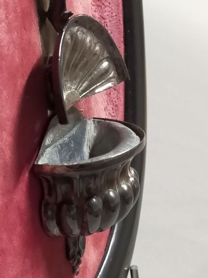 Christ on the cross in silver.

On a red...