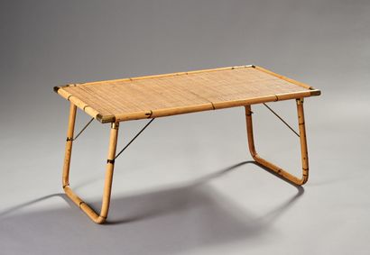 Rattan coffee table.

Folding legs.

Woven...