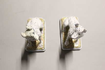 Pair of seated dalmatians in polychrome earthenware.

Rectangular...