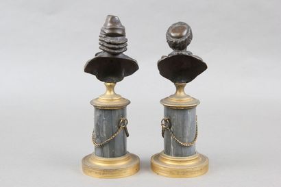 Pair of patinated bronze desk busts representing...
