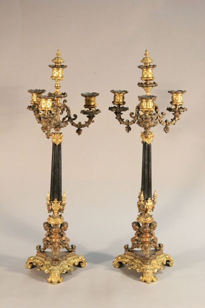 Pair of bronze and black marble candlesticks...