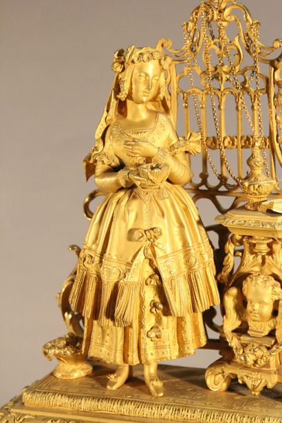 Clock in gilded and chased bronze.

The upper...