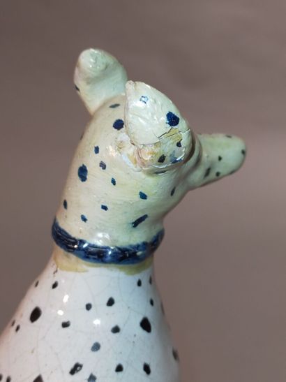 Pair of seated dalmatians in polychrome earthenware.

Rectangular...