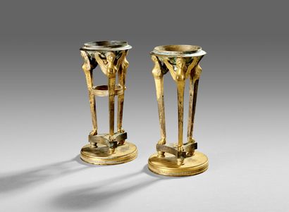 
Pair of gilt bronze cups supported by sphinxes...