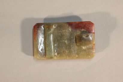 CHINA

Rust and spinach jade belt buckle.

Incised...