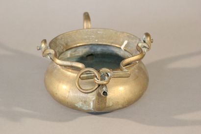 Bronze pitcher with two spouts and a mobile...