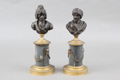 Pair of patinated bronze desk busts representing...