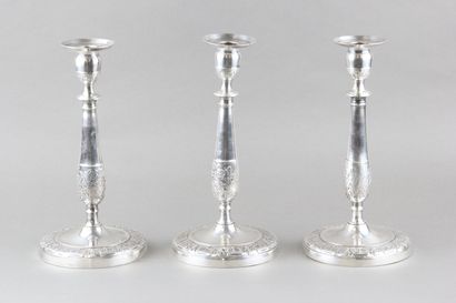 Suite of three candlesticks in silver plated...