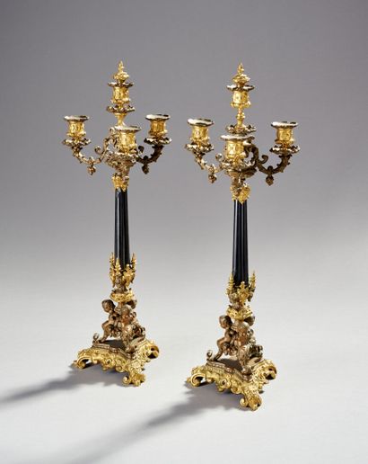Pair of bronze and black marble candlesticks...