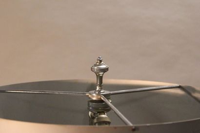 Curious lamp in chromed metal.

The body...