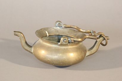 Bronze pitcher with two spouts and a mobile...