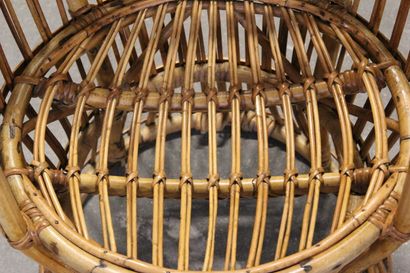 Pair of rattan armchairs.

The openwork back.

Circular...