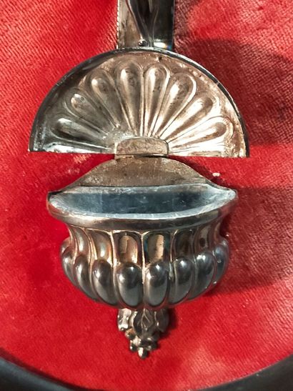 Christ on the cross in silver.

On a red...