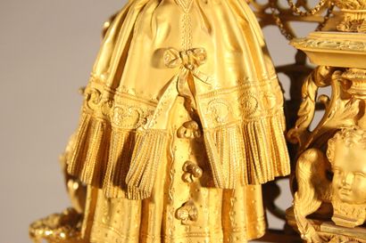 Clock in gilded and chased bronze.

The upper...