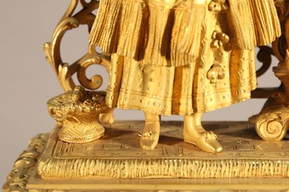 Clock in gilded and chased bronze.

The upper...