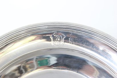 Circular silver dish bordered with nets.

Wing...