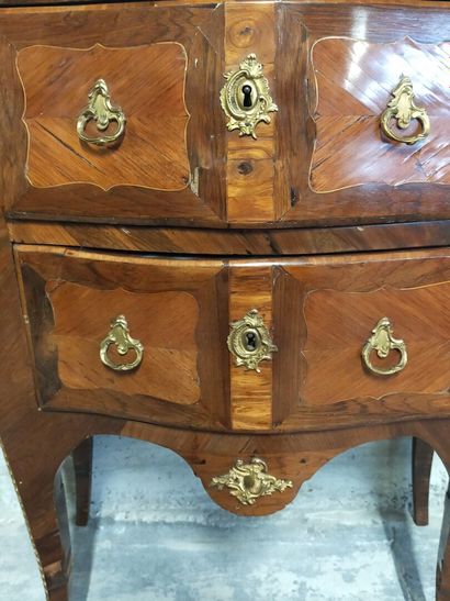 Chest of drawers with a slight curve. 

Rosewood...
