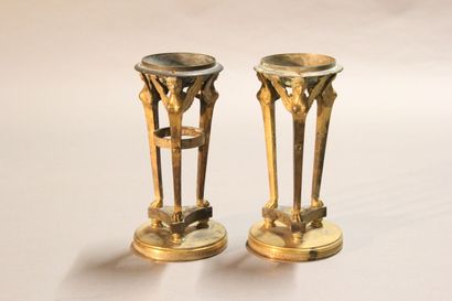 
Pair of gilt bronze cups supported by sphinxes...