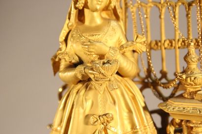 Clock in gilded and chased bronze.

The upper...