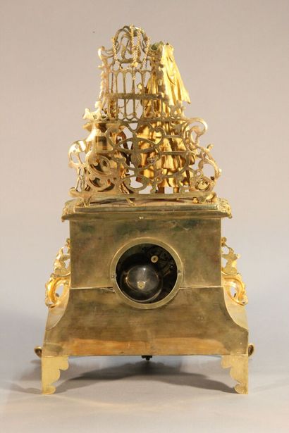 Clock in gilded and chased bronze.

The upper...