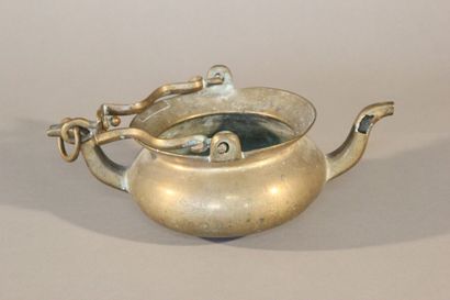 Bronze pitcher with two spouts and a mobile...