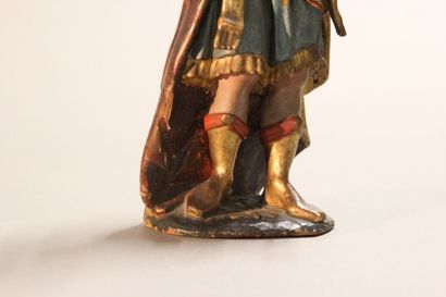 Antique soldier in armor.

Subject in polychromed...