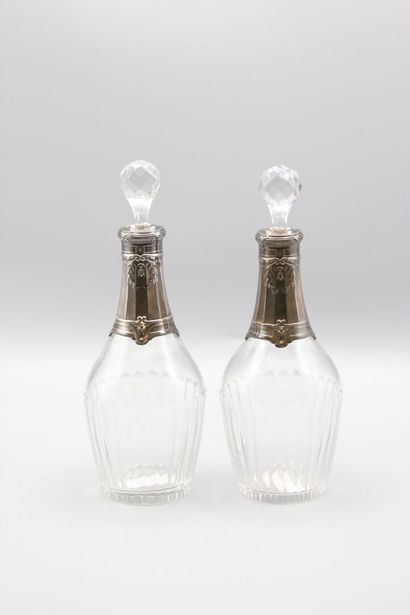 Pair of crystal carafes with coast.
Silver...