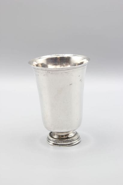 Large silver tulip-shaped tumbler, base decorated...