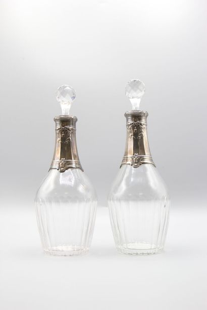 Pair of crystal carafes with coast.
Silver...