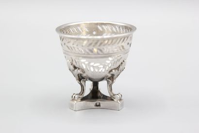 Silver egg cup with three clawed feet with...