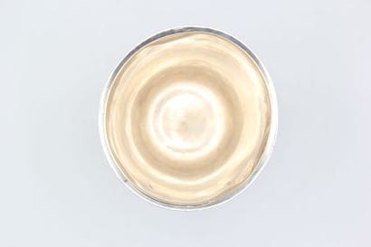 Large silver tulip-shaped tumbler, base decorated...