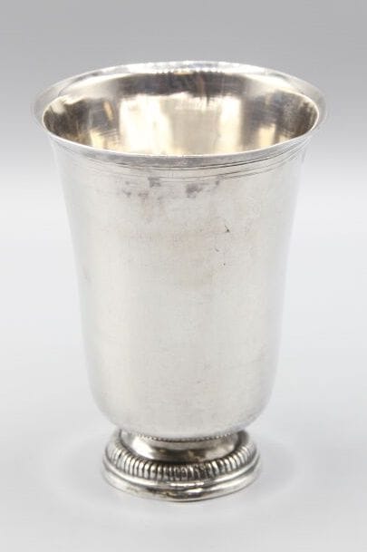Large silver tulip-shaped tumbler, base decorated...