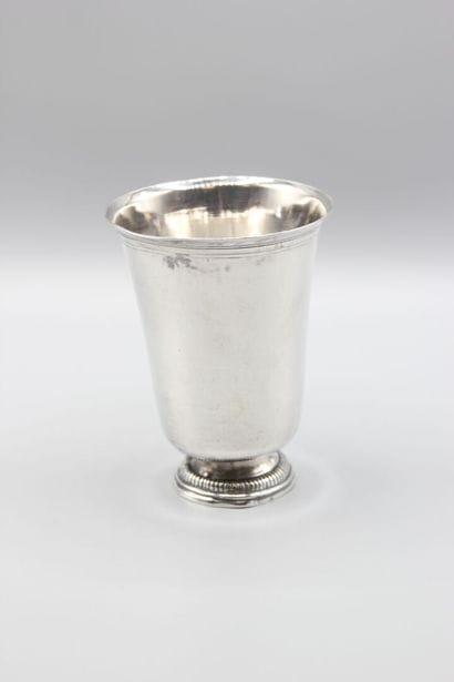 Large silver tulip-shaped tumbler, base decorated...